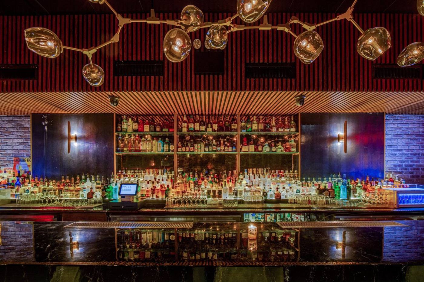 The main floor bar under globe lights